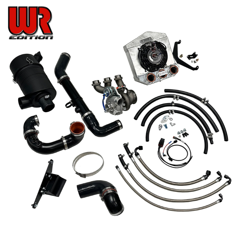 Turbo Kit parts laid out on a white background, including black and silver hoses, metal pipes, a water pump, an alternator, and mounting hardware. A large red and black 'WR Edition' logo is visible in the upper left.